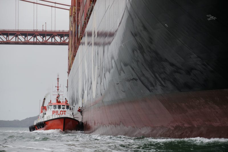 Photo: Pilot boat beside a container ship